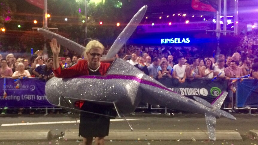 A Mardi Gras parade attendee tries her best Bronwyn Bishop