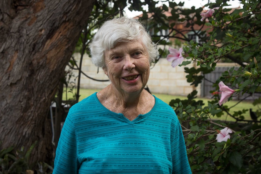 Roberta Holland in her backyard