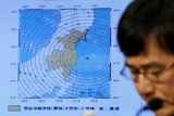 Japan Meteorological Agency's earthquake and volcano observations division director Koji Nakamura addresses a news conference.
