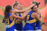 West Coast Eagles AFLW celebrate a goal against the GWS Giants in the 2020 season.