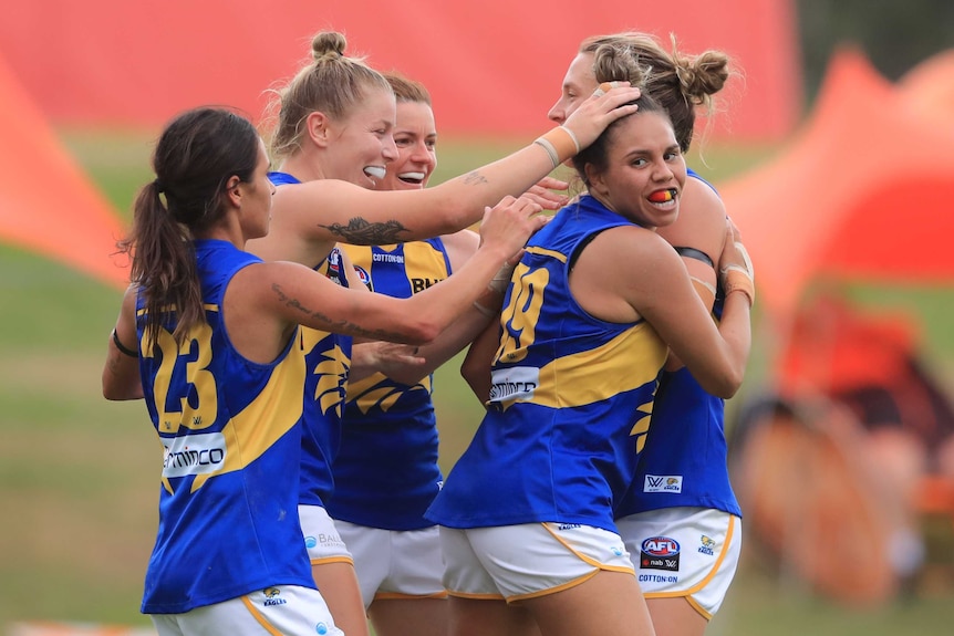 West Coast Eagles AFLW celebrate a goal against the GWS Giants in the 2020 season.