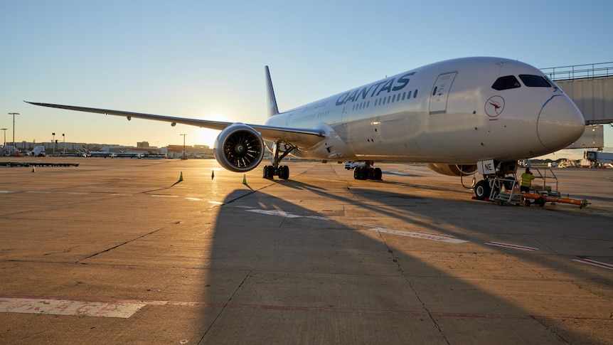 A Qantas jet on the tarmac with 