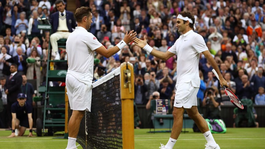 Marcus Willis congratulates Roger Federer