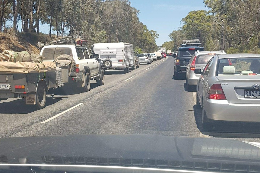 Cars backed up on the Hume Freeway near Seymour, after the surface of the road