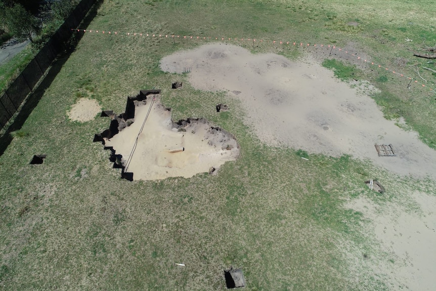 Aerial shot of land with large holes where excavation work has been conducted.