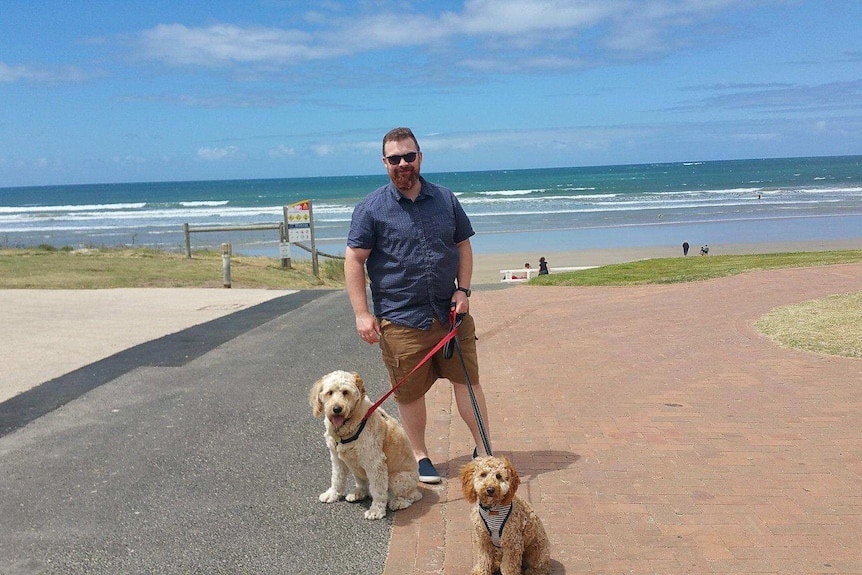 Curious Canberran Dinny McGettigan with his two dogs.