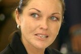Schapelle Corby bites her lip as the verdict is read out