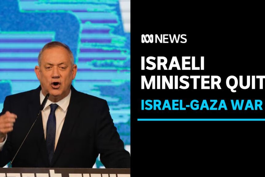 Israeli Minister Quits, Israel-Gaza War: A man in a black suit speaks into a microphone at a podium.