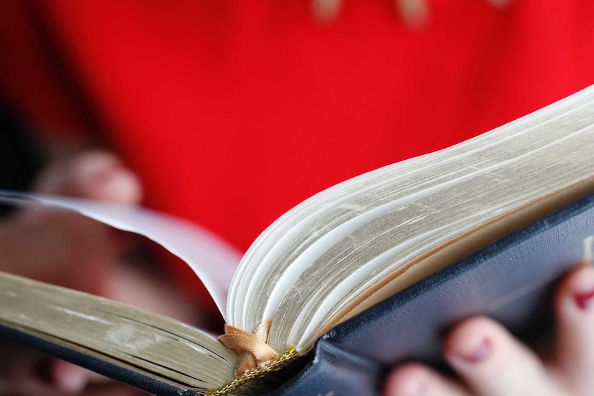 A Christian woman reading the bible.