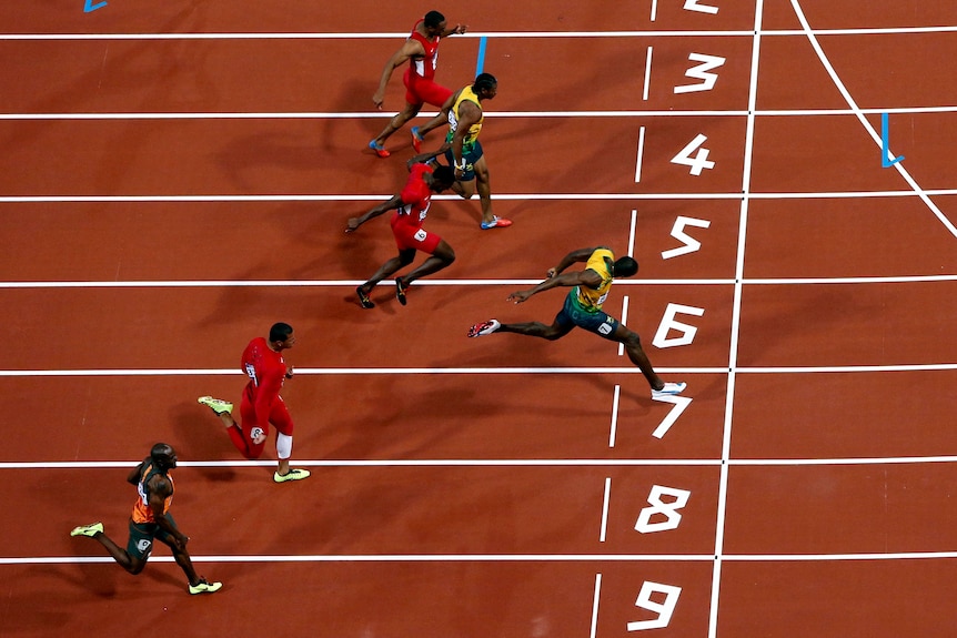 Title defended ... Usain Bolt (2nd left) wins the 100m final.