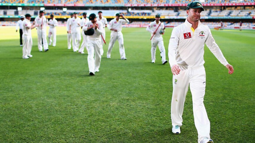 Michael Clarke leads the team off the Gabba