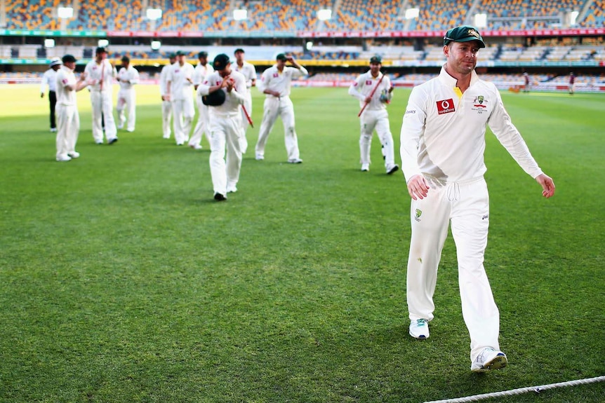 Michael Clarke leads the team off the Gabba