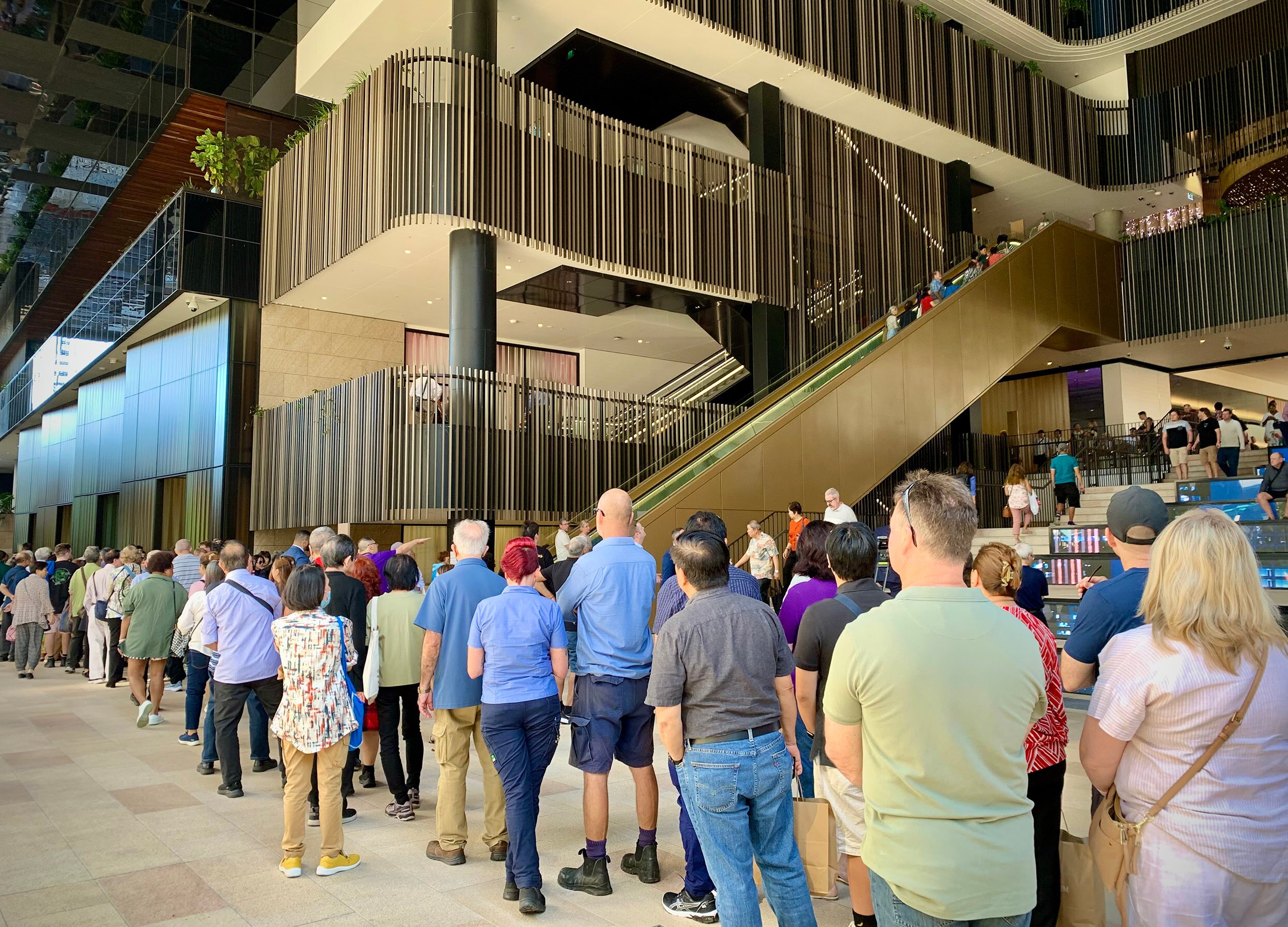 The long queue of people waiting to enter the newly opened Star Brisbane casino