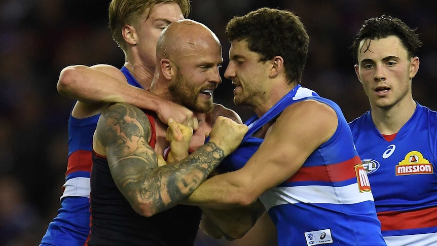 Tom Liberatore and Nathan Jones get in each other's faces