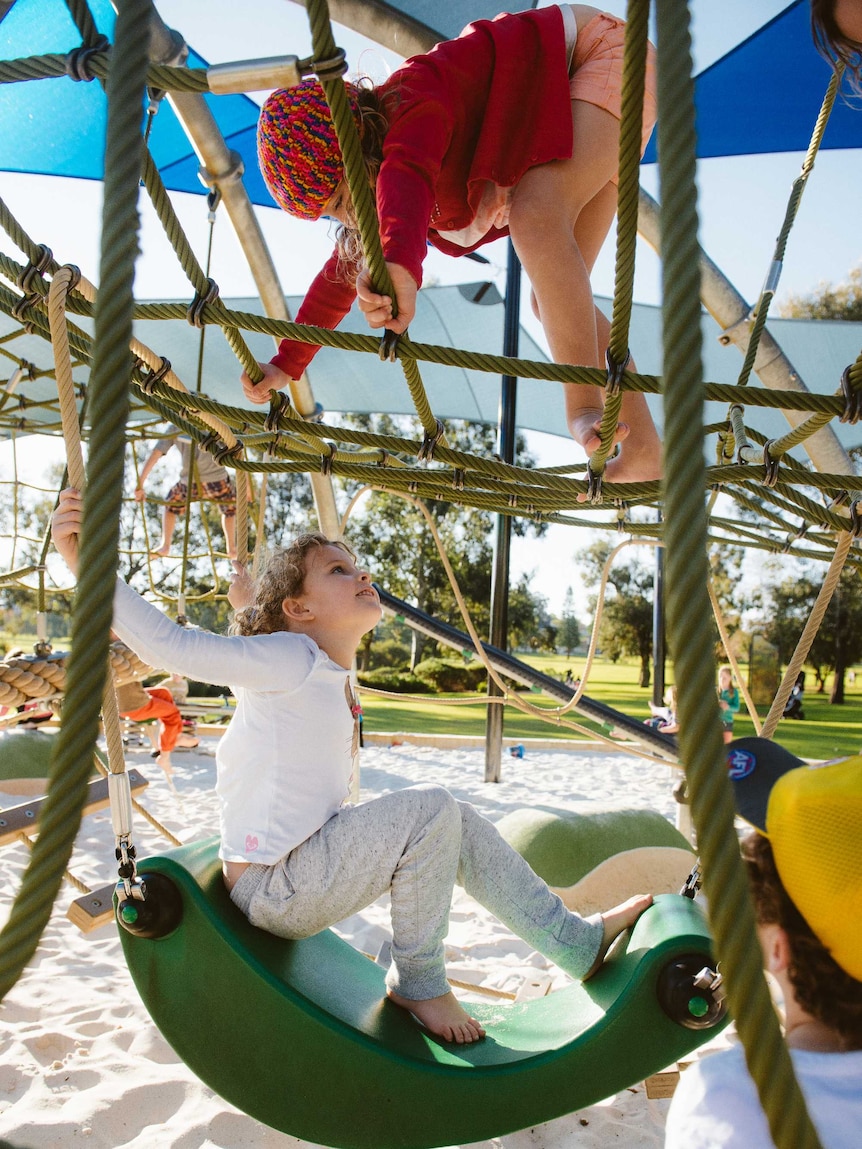 Two girls on a climbing frame