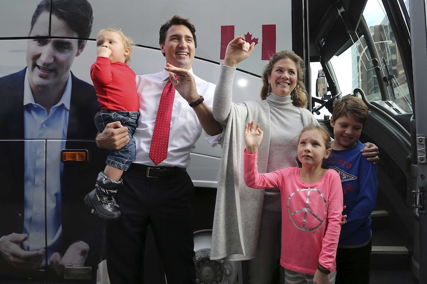 Liberal leader Justin Trudeau with his family after voting in Montreal, Quebec