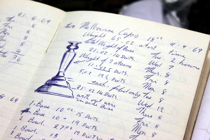 Open page of a notebook showing the length and breadth of the Melbourne Cup.