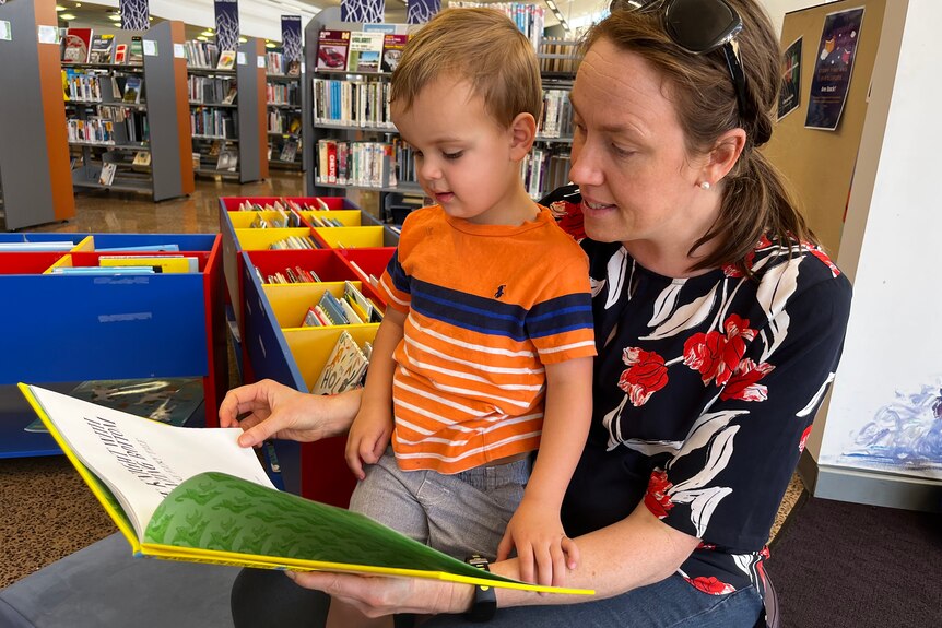 Lydia Rophe reads to her son Miles, 3, as part of the Whyalla Library's story time.  