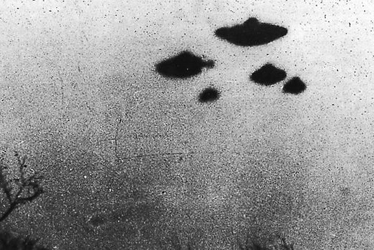 A black and white photo reportedly showing four flying saucers