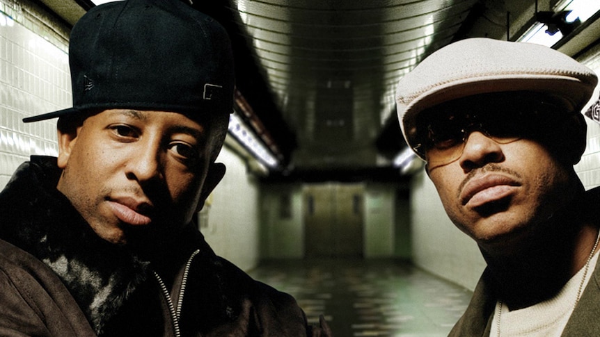 Guru and DJ Premier of Gang Starr standing in a subway station