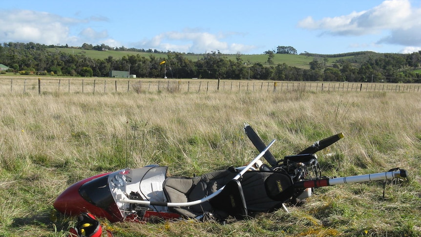 A glider lies damaged after a fatal crash at Bridport at north-east Tasmania.