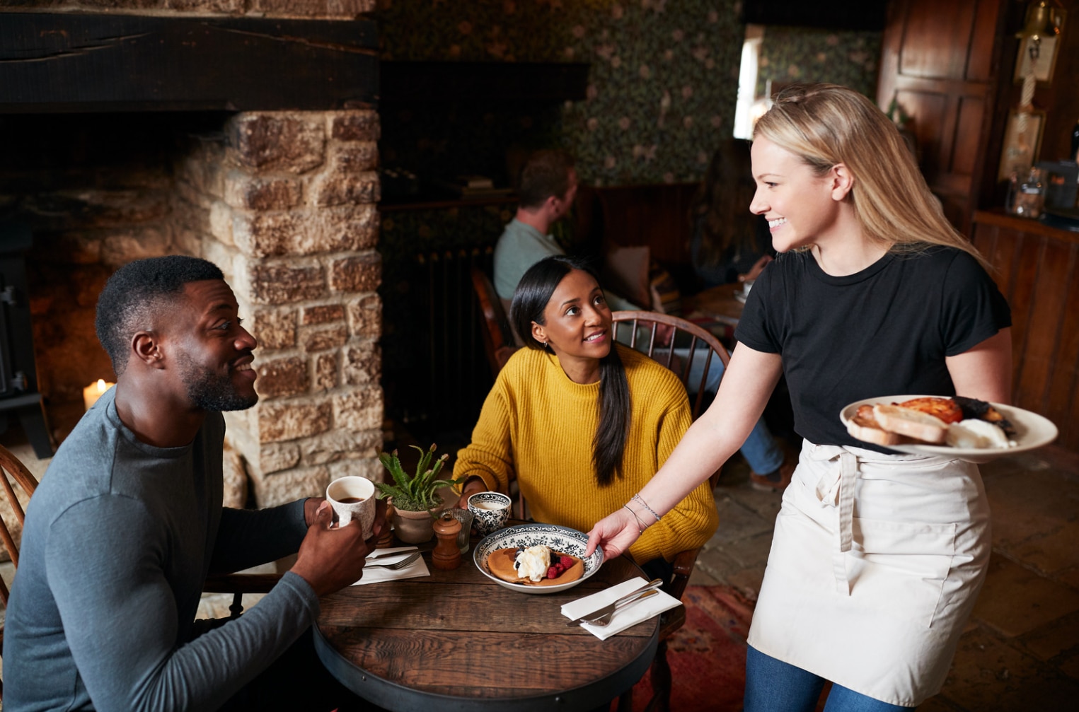 She serves. She serves. Bringing. She serves. Woman serving her husband.