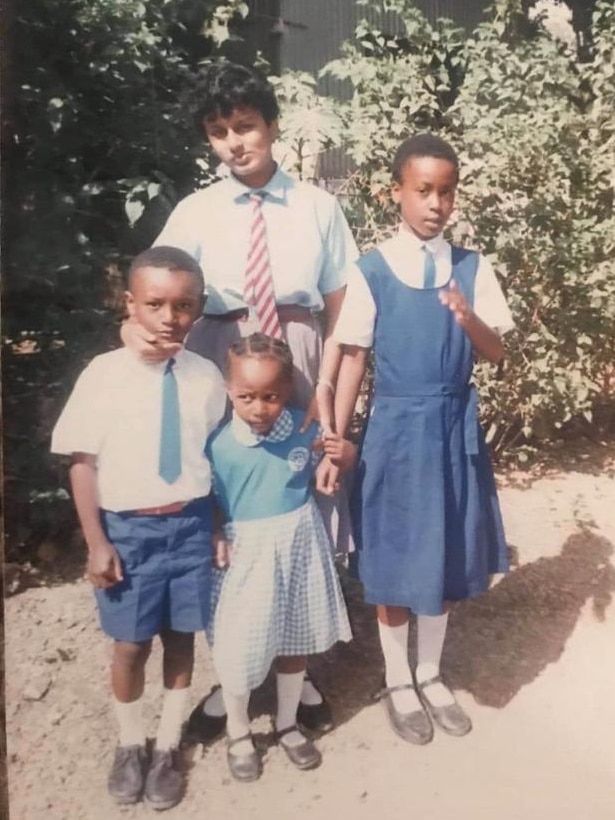 Beena Pallical and her siblings dressed in their school uniforms heading to school
