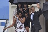Barack, Michelle, Malia and Sasha Obama disembark from Air Force One.