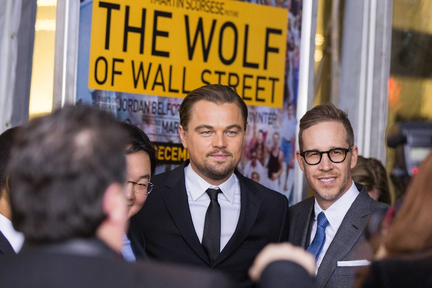 Jho Law is seen to the left of Leonardo Di Caprio at the premiere of Wolf of Wall Street.