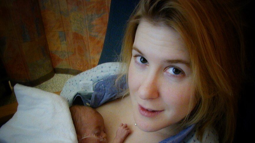 Dr Nathalie Maitre holding baby.