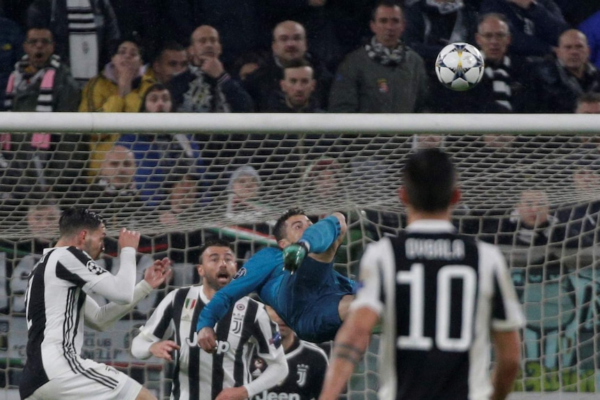 Cristiano Ronaldo in the air as he scores from a bicycle kick against Juventus.
