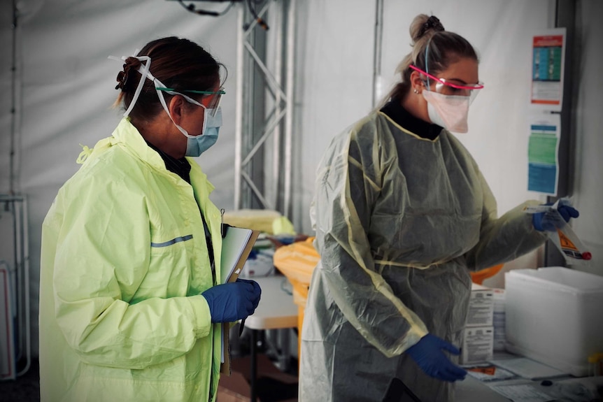 Two staff in the Hobart coronavirus mobile testing centre.