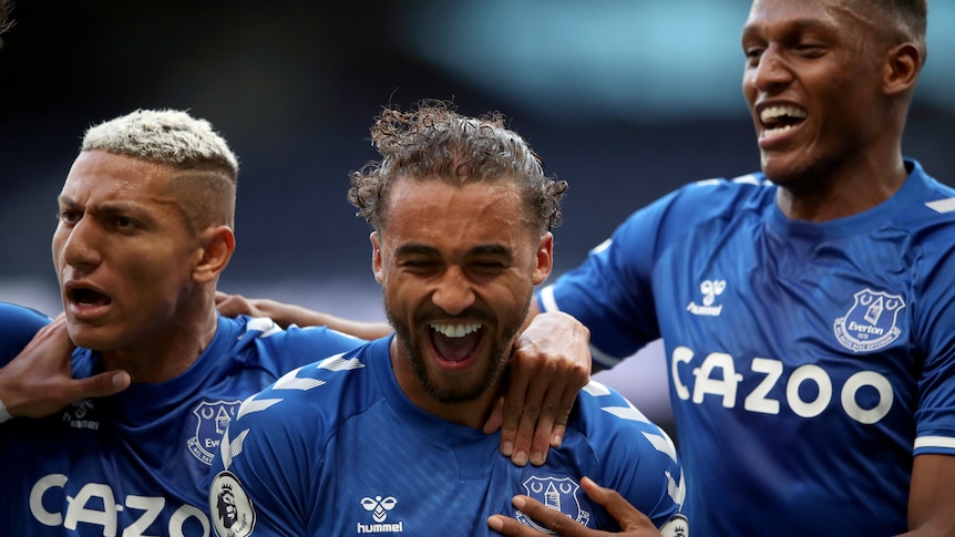 Everton players celebrate a goal.