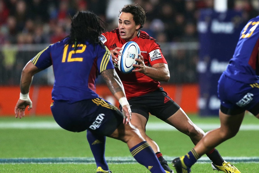 True power ... Zac Guildford runs up against the Highlanders defence.