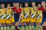 Norwegian players celebrate as Australia watches on