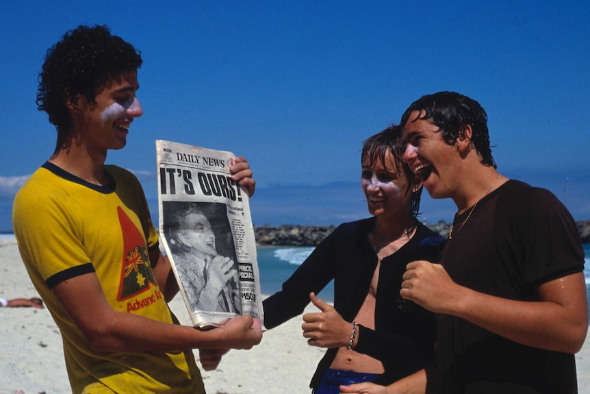 Perth residents celebrate after waking to the news Australia had won the America's Cup.