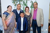Gaurav Saxena (second from left) with his late mother (left) and father (right), and his wife and son.