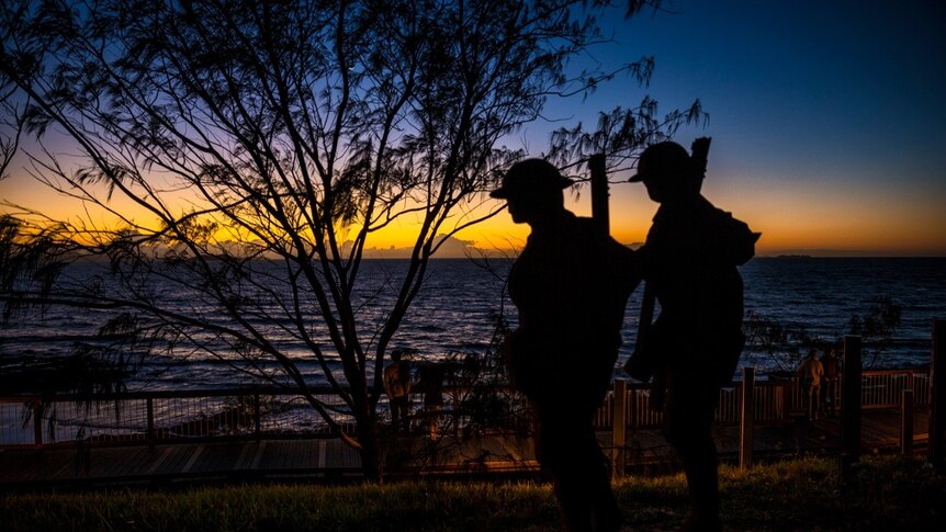 A dawn silhouette on Anzac Day at Emu park in Queensland