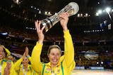 Julie Corletto raises the Netball World Cup trophy