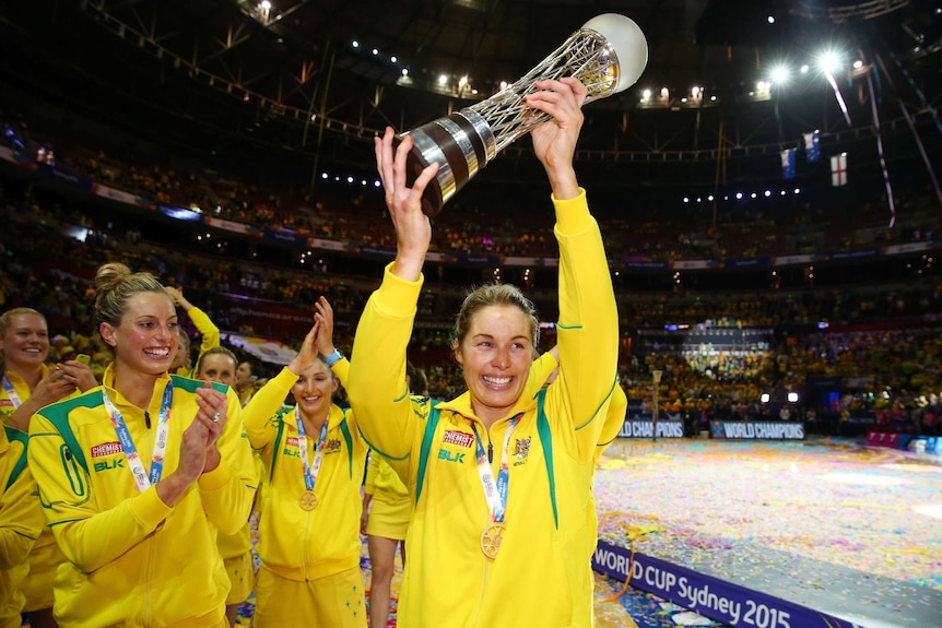 Julie Corletto raises the Netball World Cup trophy
