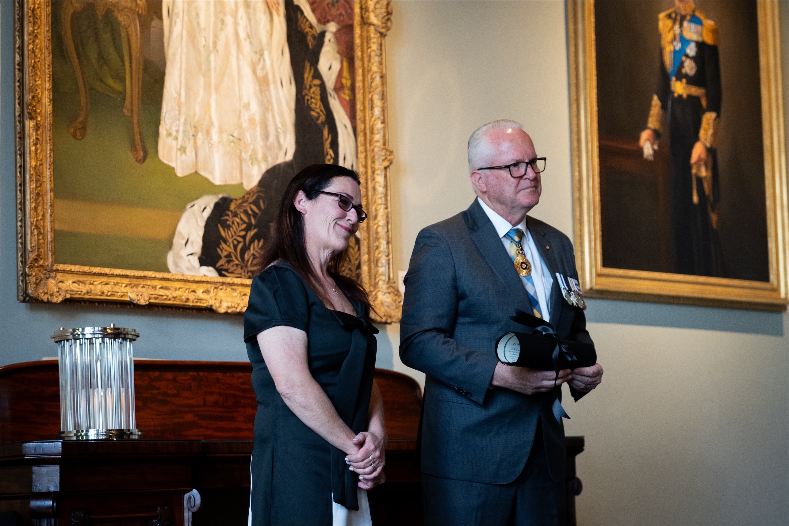 Joanne Appelbee stands next to WA Governor Chris Dawson during a ceremony at WA Government House.