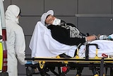 A man is rushed into Gold Coast University Hospital to undergo testing for the Ebola virus.