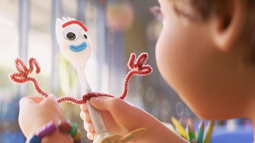 Colour close-up still looking over the shoulder of Bonnie holding toy Forky in her hands in 2019 animated film Toy Story 4.