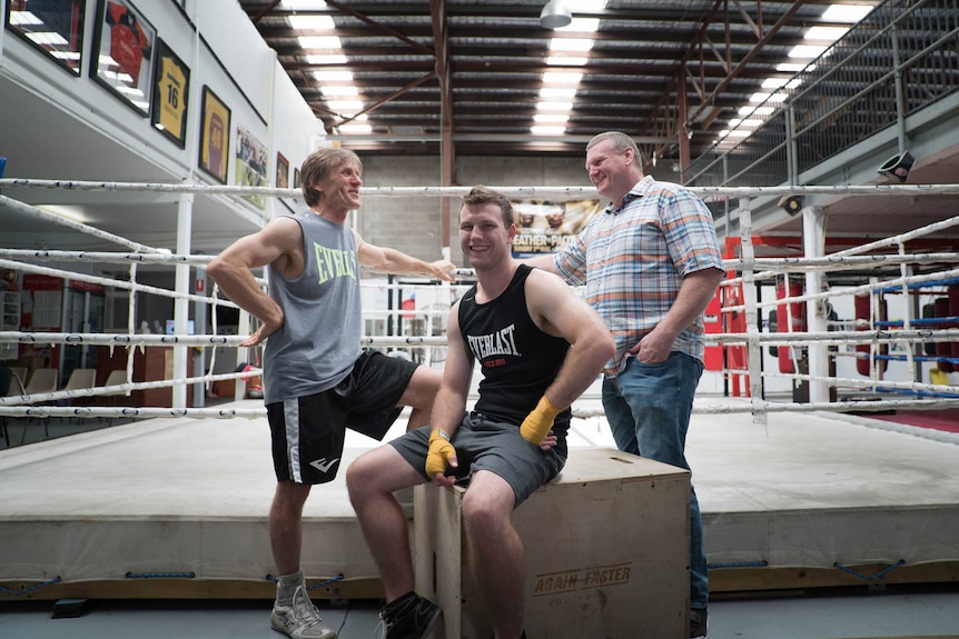 Trainer Glenn Rushton, boxer Jeff Horn and promoter Dean Lonergan at a Brisbane gym.