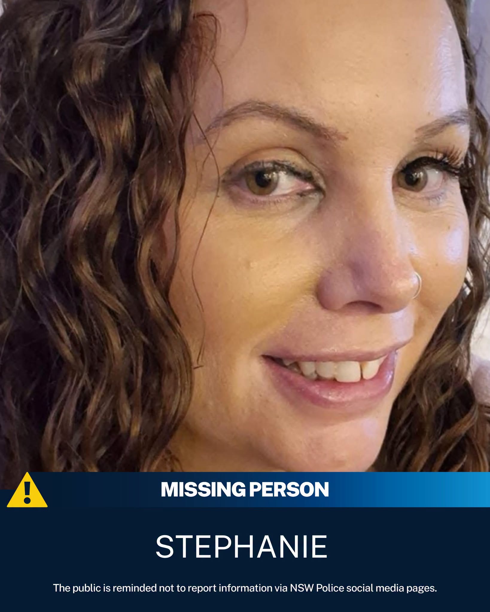 A closeup of a woman smiling.