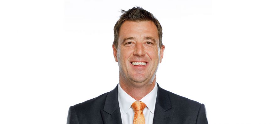 A man smiling at the camera