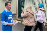 Noel McCoy handing out election material