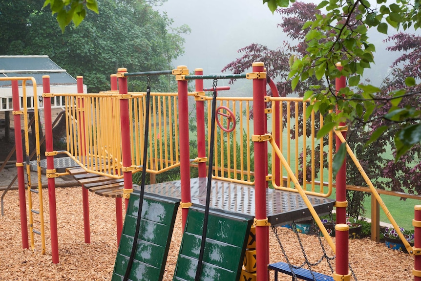 A small playground made of plastic and steel elements