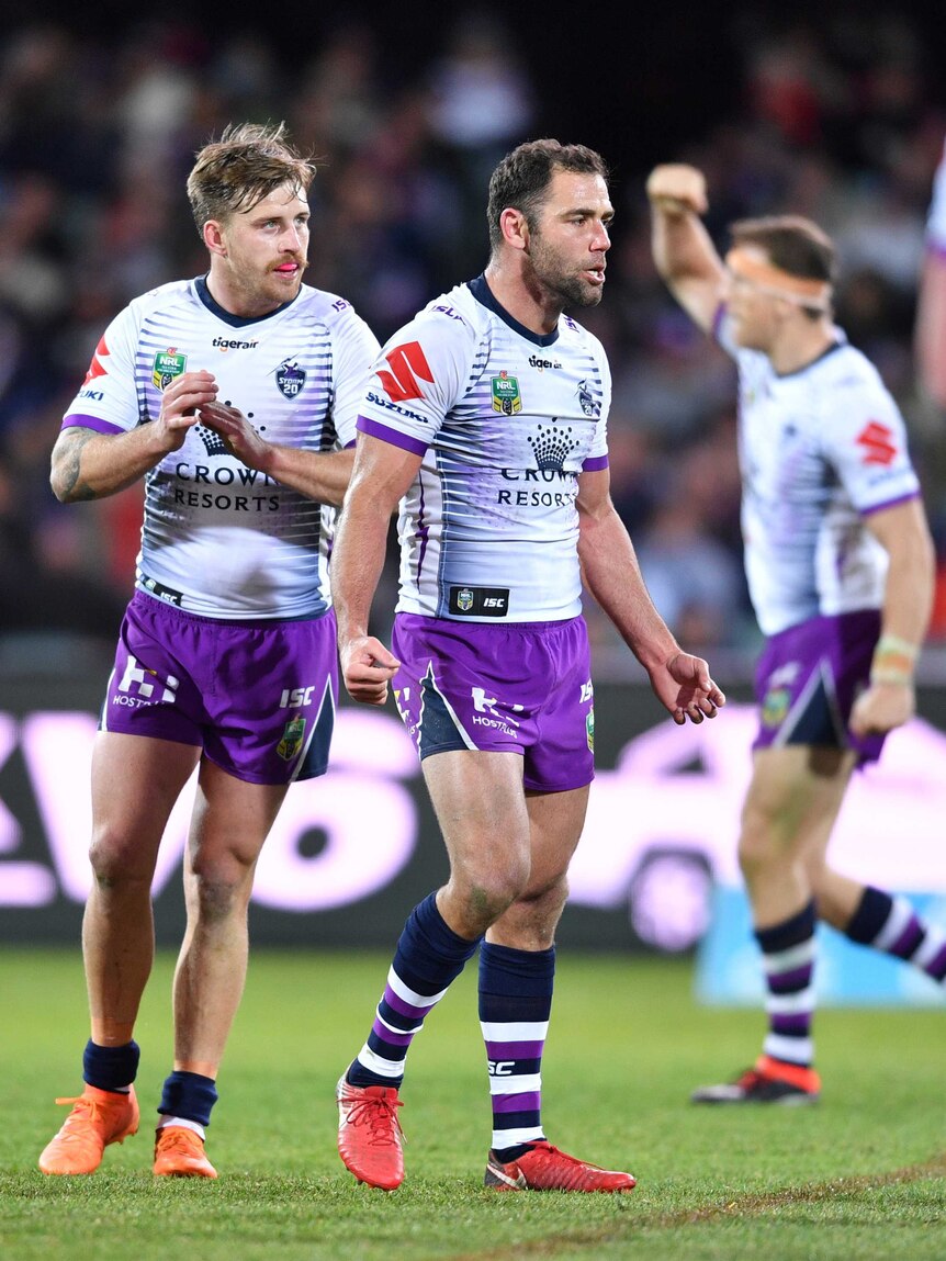 Cameron Smith celebrates kicking a field goal in the Storm's win over the Roosters.