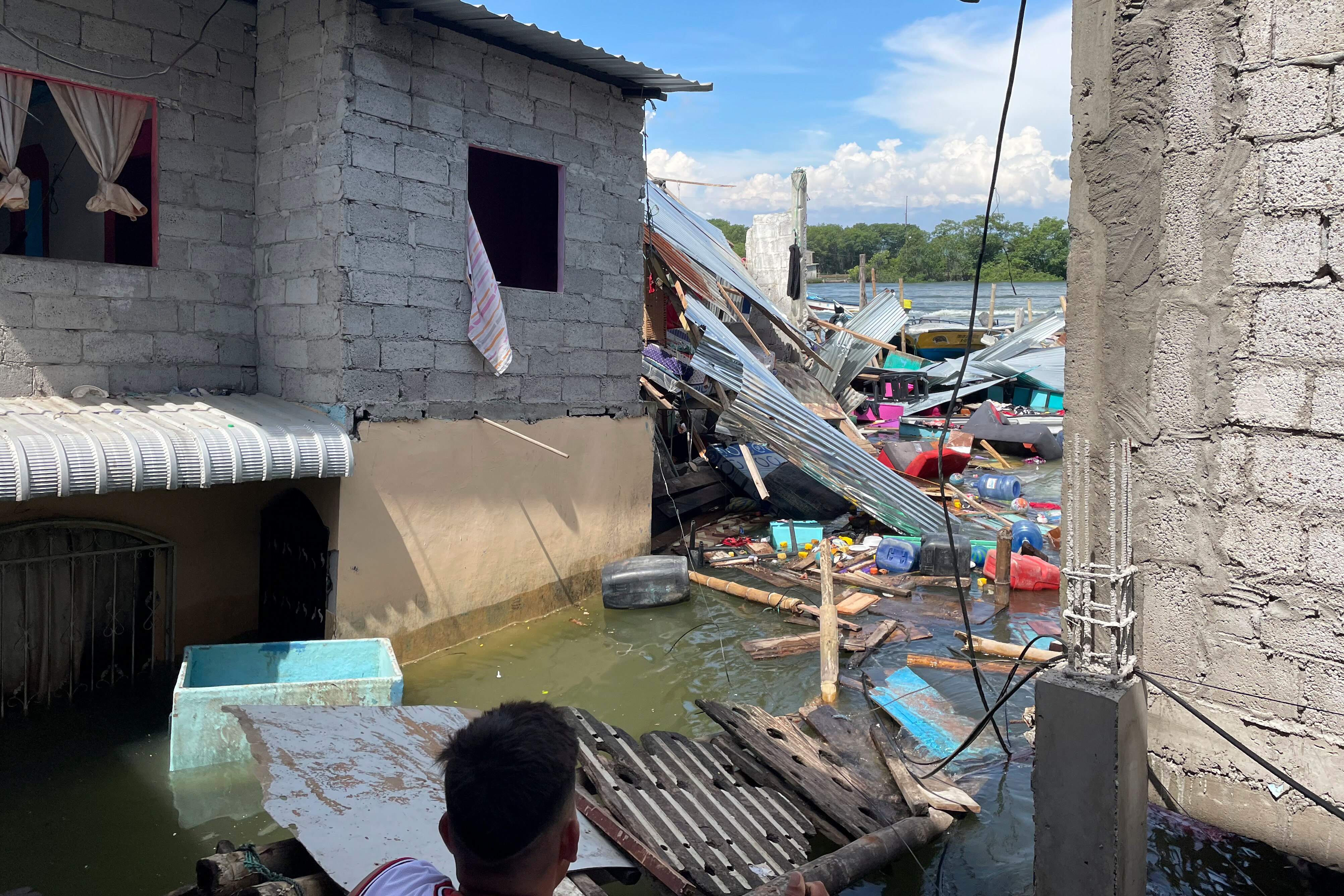 Household belongings float in water after an earthquake shook Machala, Ecuador.